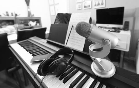 Headphones on musical synthesizer keyboard. Headphones on electronic piano. Musical backgroundの写真素材