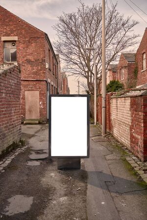 Blank advertising mockup in the street . Poster billboard on city dirty alley backgroundの写真素材
