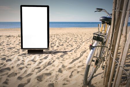 Blank advertising mockup in the street . Poster billboard on the beach backgroundの写真素材