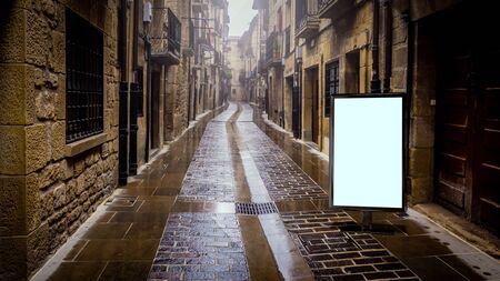 Blank advertising mockup in the street . Poster billboard on the city backgroundの写真素材