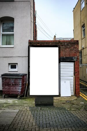 Poster billboard on city dirty alley background .Blank advertising billboard mockup in the streetの写真素材