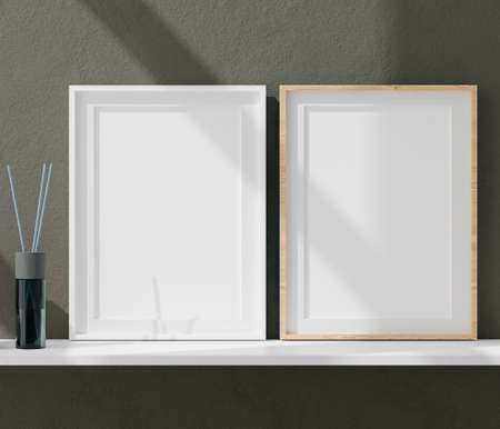 Three vertical white frame mockup, golden frame on black wall, 3d illustrationの写真素材