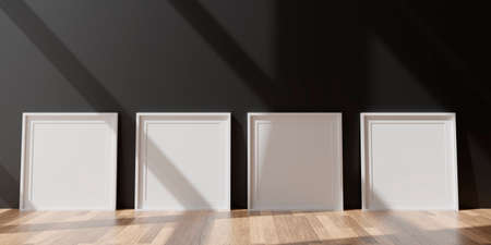 Four vertical white frame mockup, white frame on black wall, 3d illustrationの写真素材