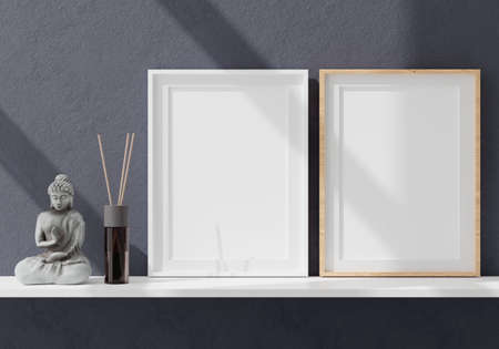 Two vertical white frame mock up, white frame on blue wall, 3d illustrationの写真素材