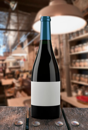 Bottle of red wine and a glass cup in a dark backgroundの写真素材