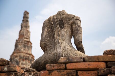 Behide the ruin of buddha statue in old temple , thailandの写真素材