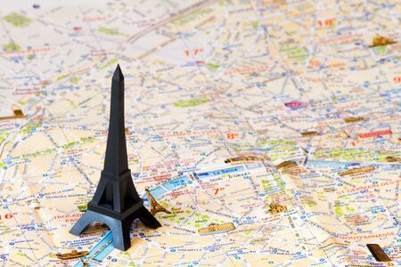 Black Eiffel tower over the map of Parisの写真素材