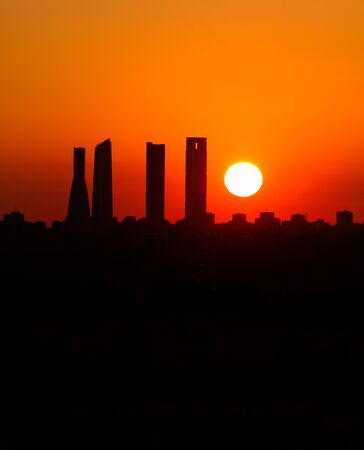 Sunrise business tower silhouette in Madridの写真素材