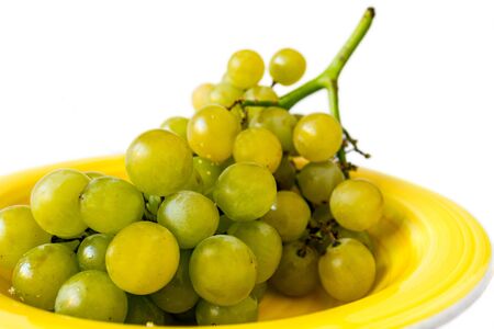 White grape on a dish ready for eatの写真素材