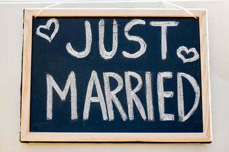 Wedding car with just married sign in a blackboardの写真素材