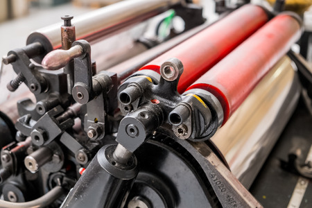 A detail of an old printing press in print shop