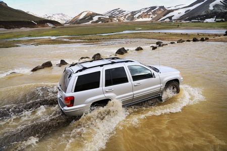 Crossing the river in a suv in Iceland.