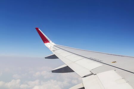 Aircraft wing on the clouds.