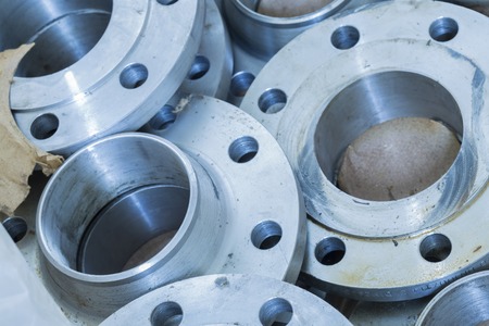 Flanges stacked in warehouse, selective focused