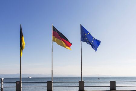 Flags of Germany and Europe at Lake Constance in Friedrichshafen harbor.