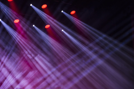 Stage lights on a console, smoke, image of stage lighting effects