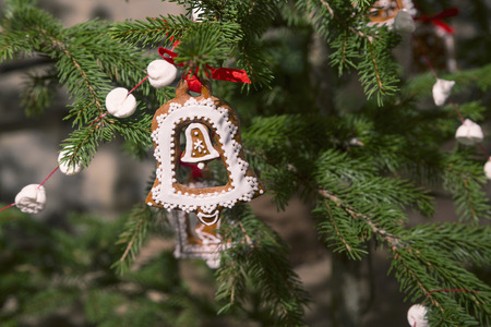 Gingerbread Christmas ornaments on tree. Small bell.の写真素材
