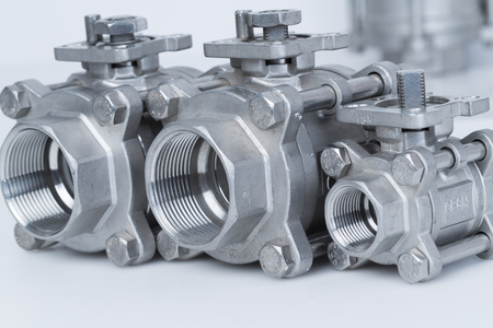 Group 3 valves, different sizes, ball valve with selective focus on thread fittingsの写真素材