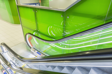 Perspective wide angle of escalators, green color combination. panoramic angle of escalator detail.の写真素材