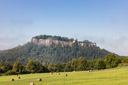 Germany. Saxon Switzerland. Fortress of Koenigstein in summer day. Fortress wall of German castle Konigsteinのeditorial素材