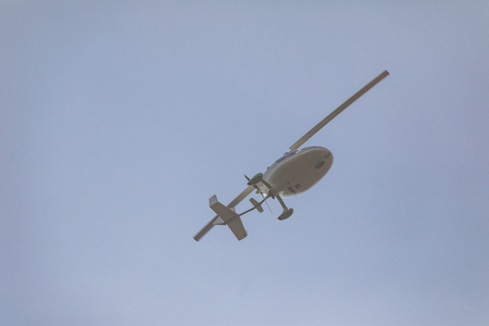 white gyroplane in sky, Ultralight gyroplaneの写真素材