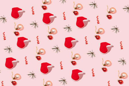 Creative pattern made with Christmas decoration on pastel pink background.Minimal flat layout .New...