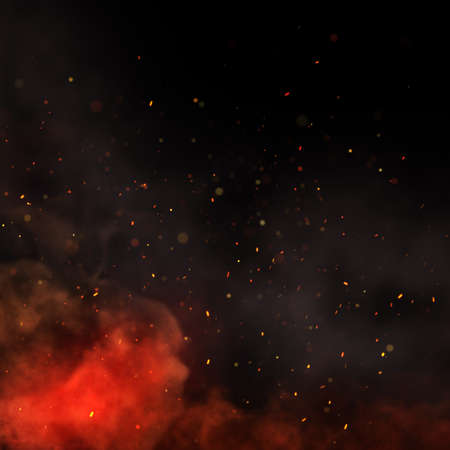Fire, smoke and sparks on black background. Close-up of glowing smoke and sparks over a campfire.の写真素材