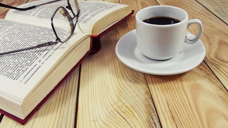 A cup coffee during the break from reading books.の写真素材