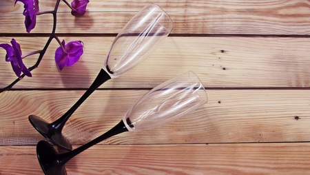 Wine glass for wine on a wooden background.の写真素材