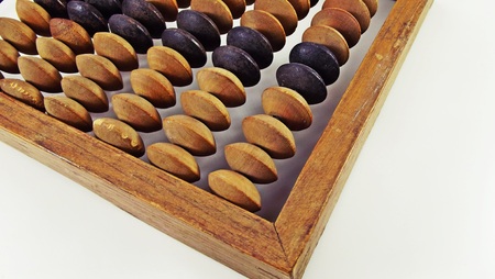 Old abacus on a white background.