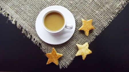 Coffee with milk and homemade biscuits.の写真素材