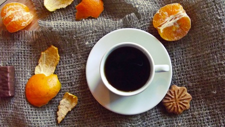 Tea with cookies and fruit on the background of burlap.の写真素材