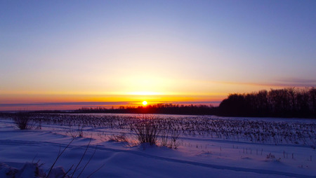 Beautiful dawn in the field.Winter day.の写真素材