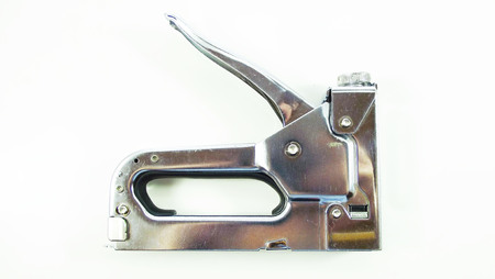 Furniture stapler on white background.