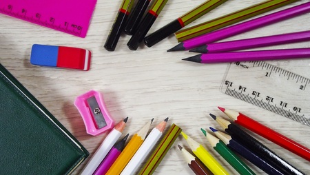 Stationery on wooden background.