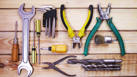 Locksmith tools on wooden background.の写真素材