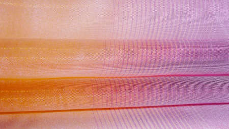 Beautiful multicolored background made of light fabric.