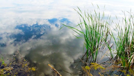 The sky and clouds are reflected in the lake.Beautiful view.の写真素材