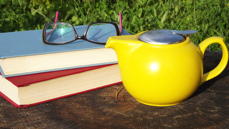 Fragrant tea in the fresh air in the break from reading books.の写真素材