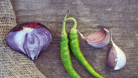 Spicy and healthy vegetables on a wooden background.The harvest from the garden.の写真素材