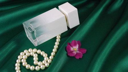 White pearls on a green drapery.の写真素材