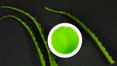 Aloe Vera cosmetic on a black background.の写真素材