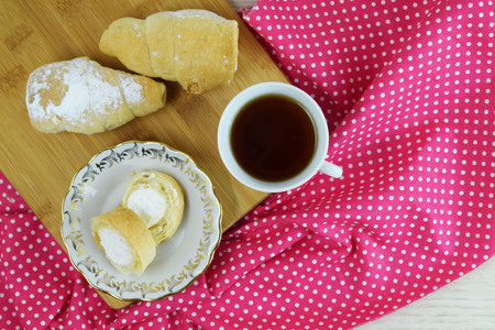 Delicious cake tubes with protein cream and fragrant fresh tea.