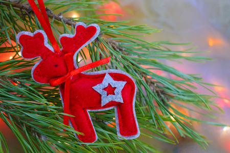 Christmas card.Christmas toys on the background of lights from the garland.の写真素材