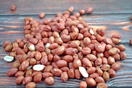 Peanuts on wooden background.Healthy.