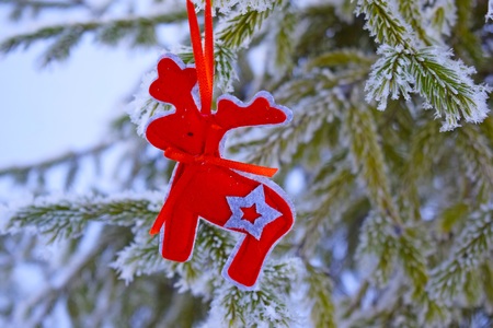 Beautiful Christmas tree on a snow-covered Christmas tree. New year holiday.の写真素材