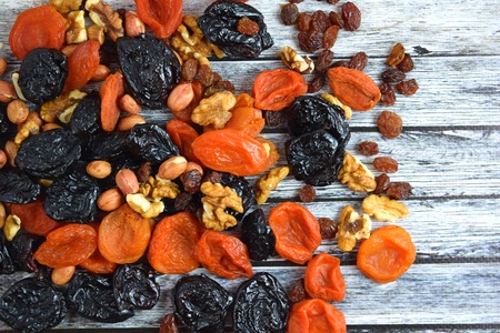 Dried fruits and nuts on wooden background.Healthy.の写真素材