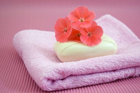 Fragrant flower soap on a pink towel.の写真素材