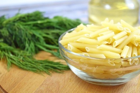 Green pasta on wooden background.の写真素材