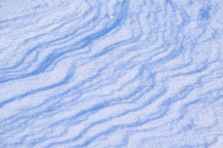 A cold winter day. Drawing on snow. Snowdrift. Abstract background.の写真素材